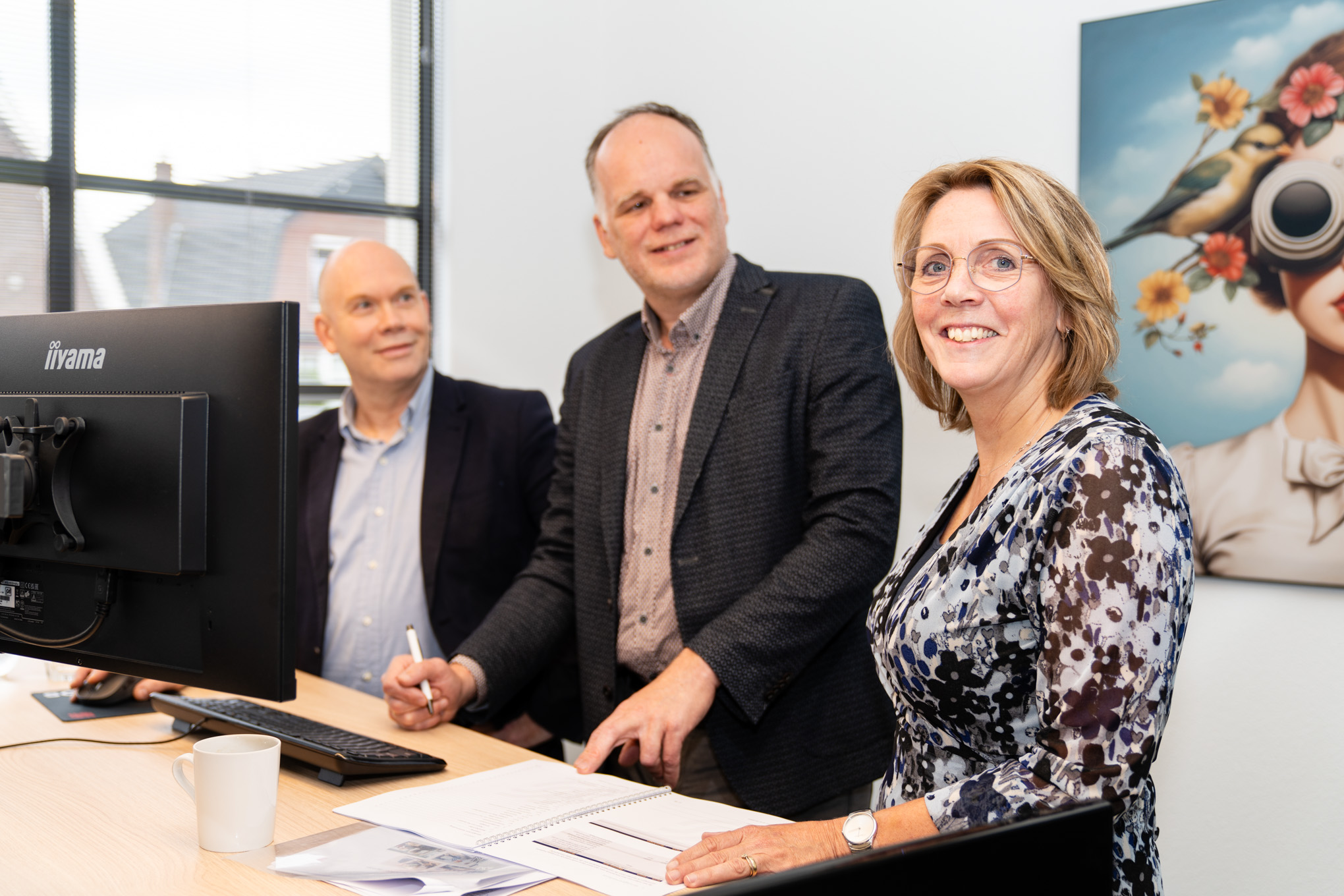 Skopos consultants in overleg met klant over ERP en PLM integratie aan bureau